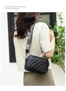 Black quilted leather crossbody bag with wide patterned strap for daily fashion.