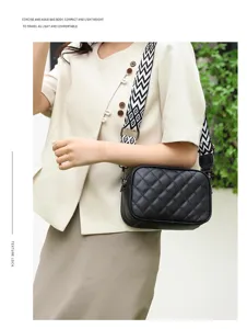 Black quilted leather crossbody bag with chic geometric wide strap for women daily casual style.