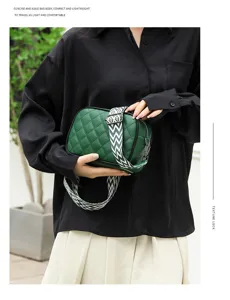 Green quilted leather crossbody bag with stylish patterned wide strap for daily use.