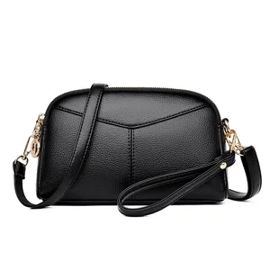 Classic black PU leather women's shoulder bag with chic hardware and versatile design.