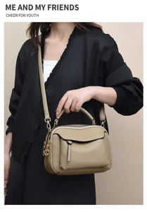 Fashionable women's crossbody soft leather handbag with multi-function zipper pockets.