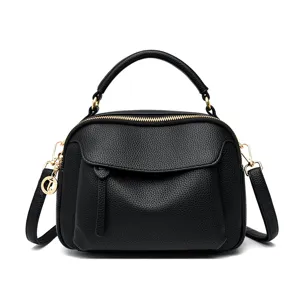 Classic black leather handbag for women, top handle shoulder bag with gold hardware.