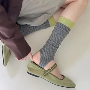 Retro Japanese style spliced color-block stirrup socks and long leg warmers detail view.