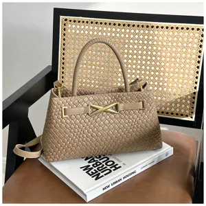 Elegant woven leather top-handle shoulder bag for women, versatile daily messenger purse.