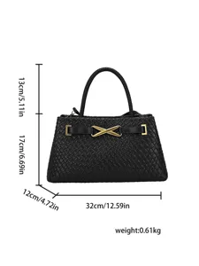 Elegant black woven handbag with top handle and golden X hardware, spacious design for women.