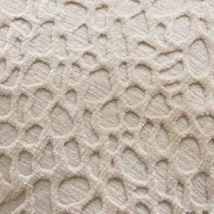 Chenille cushion cover fabric detail, soft textured throw pillow slipcase in beige color.