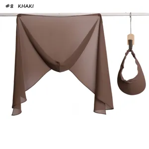 Detail view of the khaki chiffon hijab and matching lightweight sun visor for summer wear.