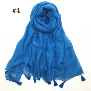 Blue voile scarf with tassels, detailed view of the lightweight breathable fabric.