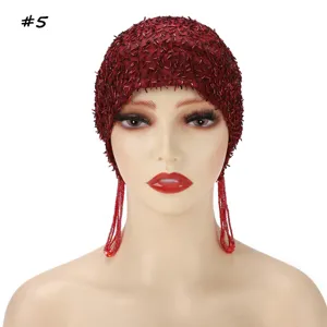 Red beaded mesh fringe cap detail, elastic stretch turban hat, stylish headwear accessory.