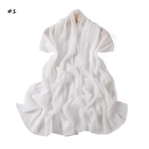 Detailed view of the white shimmering chiffon scarf, fine pleats texture and soft feel.
