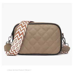 Genuine leather quilted crossbody bag for women, stylish camera bag with wide woven strap.
