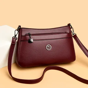 Elegant burgundy leather crossbody bag for women, stylish shoulder bag with spacious capacity.