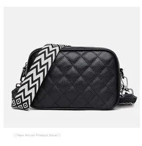 Black leather quilted crossbody bag with wide geometric strap for women stylish daily use