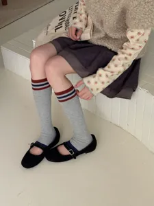 Classic grey knee-high socks featuring stylish red and blue stripes for vintage autumn daily wear.