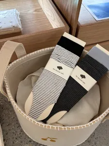 Women's stylish stirrup socks featuring striped and color-block designs with nice packaging.