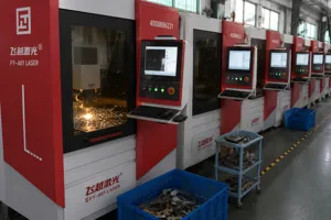 Industrial laser cutting machine with high precision CNC control panel for factory metal processing.
