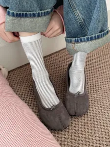 Autumn split-toe striped socks paired with comfortable grey flat shoes, stylish daily wear.