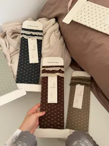 Cozy floral lace stirrup socks for women, vintage style comfortable cotton blend leg warmers.
