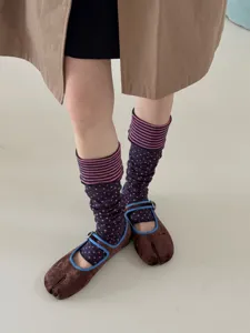 Details of Korean style contrast color polka dot striped layered socks with split-toe shoes.