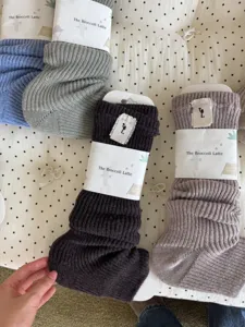 Detailed view of cozy knitted slouch socks in multiple colors, perfect for autumn and winter.