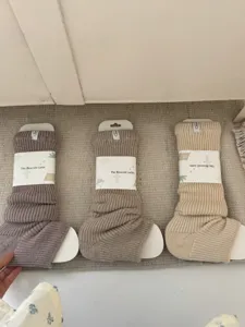 Cozy knit leg warmers in neutral colors, thick and warm winter knit socks for daily wear.