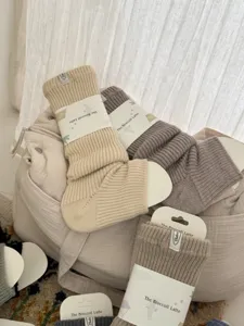 Cozy knit leg warmers for women, thick wool blend winter boot cuffs, solid color warm socks.
