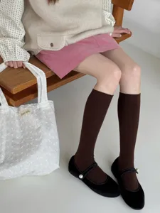 Detailed shot of Japanese style brown ribbed knit knee high socks for autumn and winter.