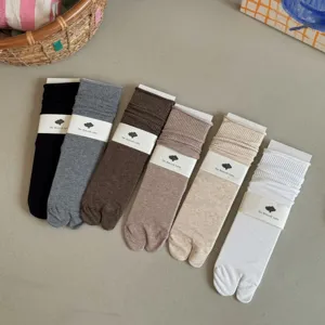 Solid color split-toe mid-calf slouch socks set, flat lay view featuring multiple colors.