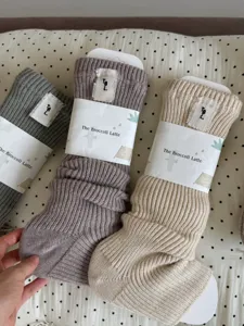 Thick knit wool slouch socks for women, cozy winter thermal long socks in various nice colors.