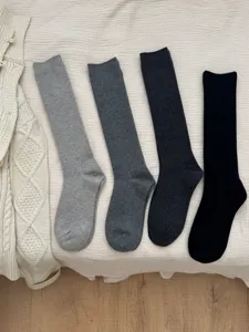 Chic ribbed wool blend calf socks in four versatile neutral colors for cozy autumn winter style.