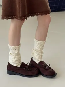 Beige chunky knit slouchy socks detail view, soft cozy winter warm hosiery footwear style