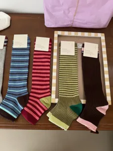 Retro striped stirrup socks for women, comfortable combed cotton knee high stockings casual daily wear.