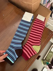 Cozy striped long socks with contrast color design, stylish knee high cotton socks.