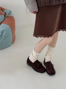 Detailed view of Japanese ins style thick knit wool slouch socks and brown loafers outfit.