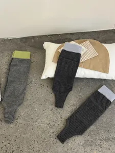 Detail view of stylish striped stirrup socks, comfortable knit fabric, breathable and cozy style.