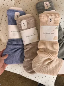 Cozy knitted slouch socks for women, thick wool blend winter crew socks, cute package style.
