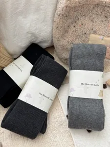 Cozy ribbed wool blend tights in neutral solid colors, warm winter opaque pantyhose for women.