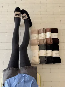 Winter knitted tights and warm solid color wool leggings for women detailed view showing soft fabric.