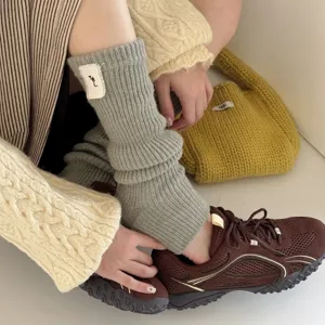 Cozy grey knitted leg warmers stirrup socks winter aesthetic warm hosiery stylish fashion accessory
