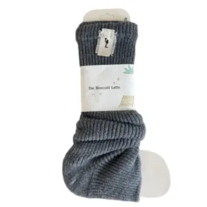 Dark grey chunky knit wool leg warmers socks with packaging band and tag, cozy winter style.