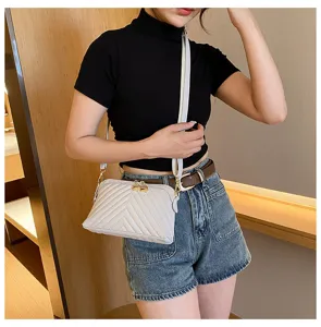 Detailed view of women casual chevron quilted crossbody shoulder bag with double zippers.