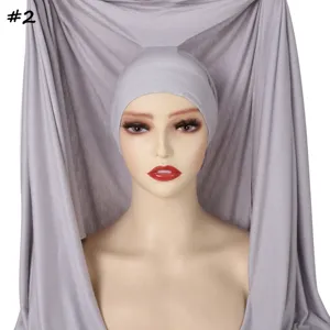 Detail view of the grey integrated hijab and long scarf cap, featuring soft knit fabric.