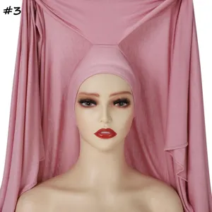 Detail shot of the solid pink pullover hijab and long scarf combination, soft breathable fabric.