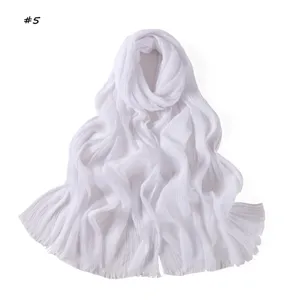 Detail view of solid color pleated fringed women's scarf shawl, breathable and fashion.