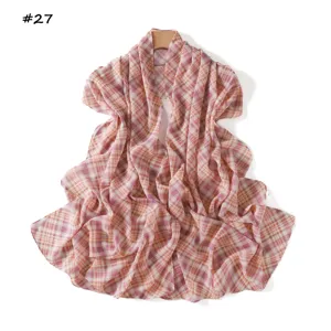 Close-up of pink plaid chiffon scarf fabric lightweight breathable texture detail