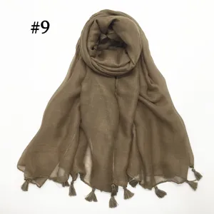 Detailed close-up view of lightweight solid color voile scarf featuring delicate fringe tassels.