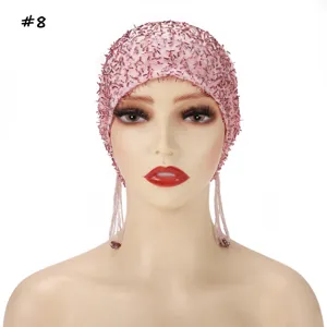 Pink beaded mesh cap with tassel design, stylish and comfortable headwear for women.