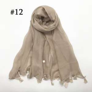Solid color thin voile scarf with hanging tassels, lightweight breathable shawl for women.