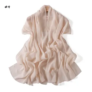Shimmer pleated chiffon shawl detail, lightweight translucent sheer pink scarf fabric texture.