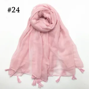 Detail view of the solid pink voile scarf with delicate tassel fringe for women and daily wear.